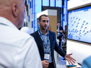 CCW 2023 - Airbus Business Analyst demonstrating Agnet Dispatcher on a screen to two visitors