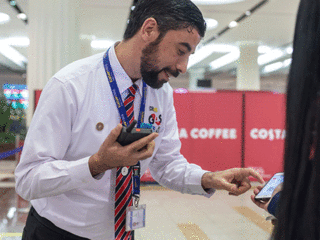 dubai airport staff with tactilon dabat device
