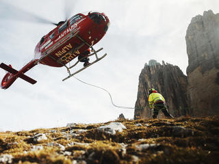 Medical evacuation helicopter landing to Tre Cime Italy