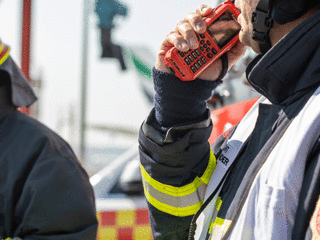 Fireman using thr9ex TETRA radio at Dubai airport