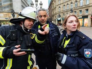 Police and fireman using Agnet map feature and firman points a point of interest