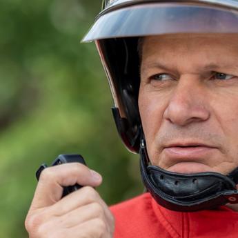 Fireman face focus using PTT accessory to communicate