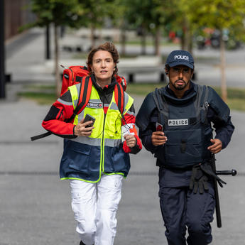 Medic and police running