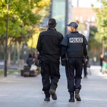 police_officers_walking_in_a_park.jpg