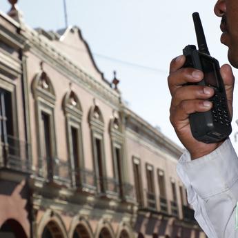 Police officer using a radio phone