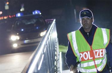 Police at night with reflecting vest Police at night with reflecting vest