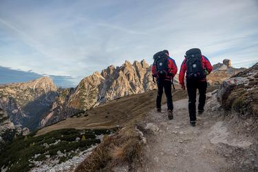 Two hikers walking in the moutains Two hikers walking in the moutains