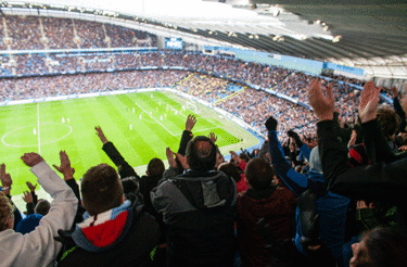 Tribune view of a Football stadium full of supporters Tribune view of a Football stadium full of supporters