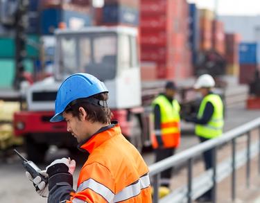 professional worker using TETRA radio in a port professional worker using TETRA radio in a port