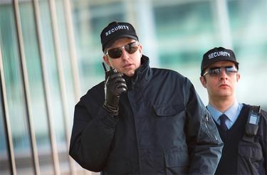 Two security officers with TH1n TETRA radio Two security officers with TH1n TETRA radio