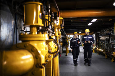 Industry workers checking the pipes for leaks and informing about the situation with Agnet Industry workers checking the pipes for leaks and informing about the situation with Agnet