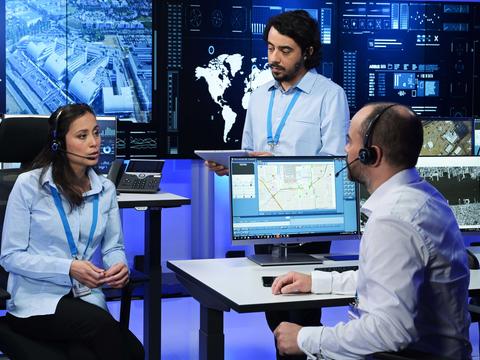 Command and Control room operators discussing the mission and using RCS9500