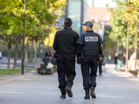 police_officers_walking_in_a_park.jpg