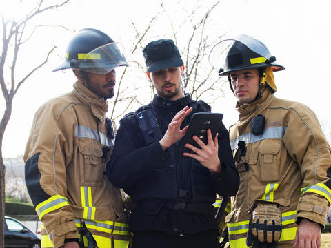 Private Security officer providing a situational update with Agnet on a crosscall tablet