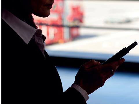 Airport worker using a device