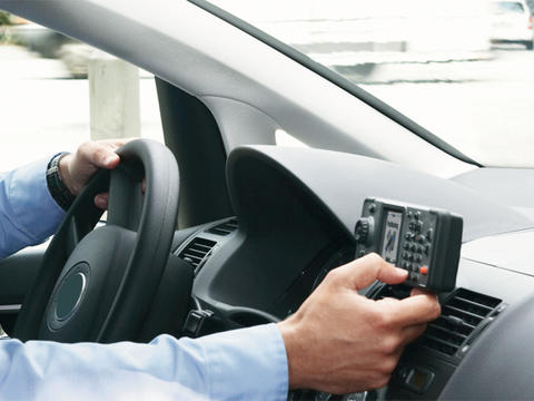 Security professional using TMR880i mobile radio