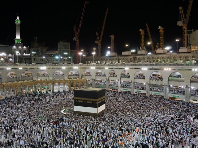 hajj pilgrimage in mecca people surrounding the kaaba in the night