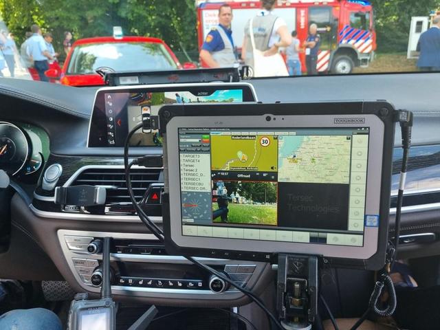 Broadway project mission critical app on a device in a car - fire departement in the back
