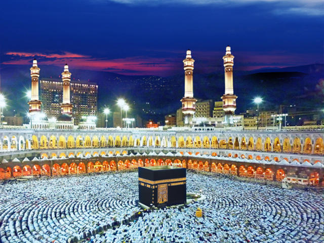 Hajj pilgrimage in mecca - people praying surrounding the kaaba