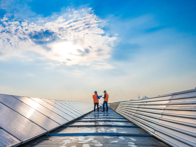 Industry workers on the roof