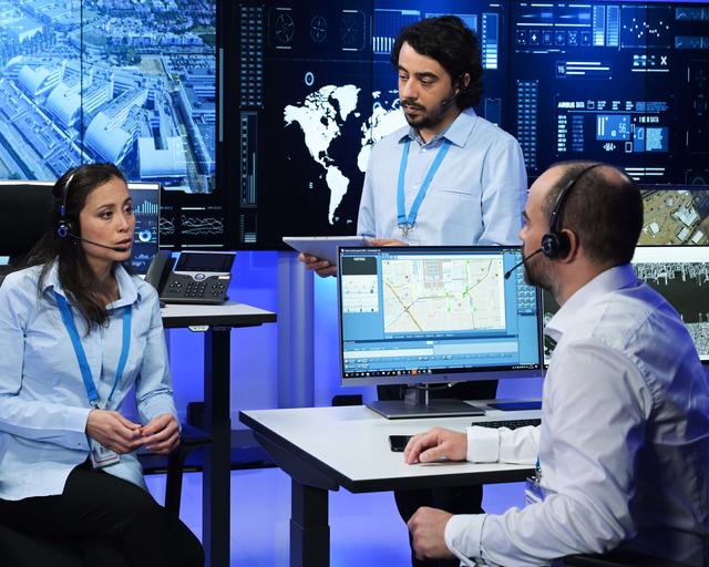 Command and Control room operators discussing the mission and using RCS9500