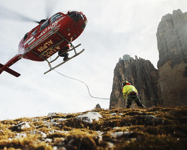 Medical evacuation helicopter landing to Tre Cime Italy