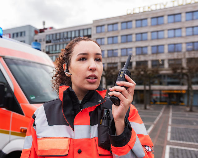 Paramedis speaking to a TH9 TETRA terminal