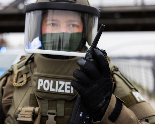 Swat officer talking to a TPH900 Tetrapol terminal Swat officer talking to a TPH900 Tetrapol terminal