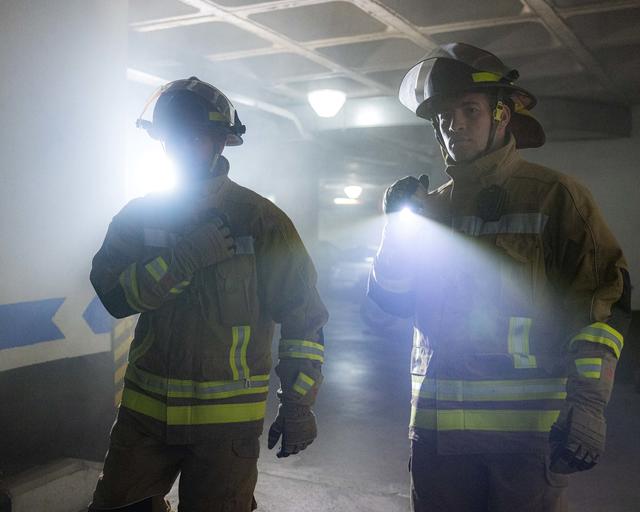 Firemen entering a building