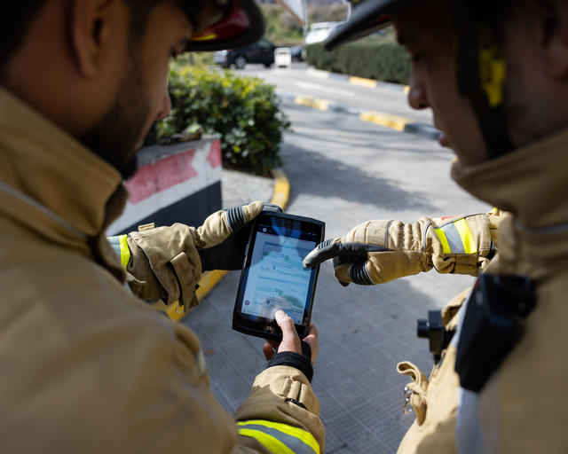 Firemen using agnet on a tablet
