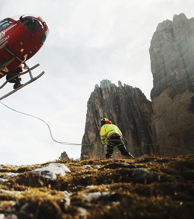 Medical evacuation helicopter landing to Tre Cime Italy