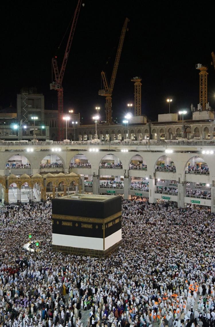 hajj pilgrimage in mecca people surrounding the kaaba in the night