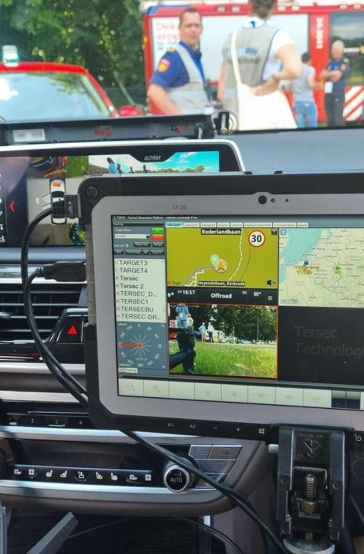 Broadway project mission critical app on a device in a car - fire departement in the back