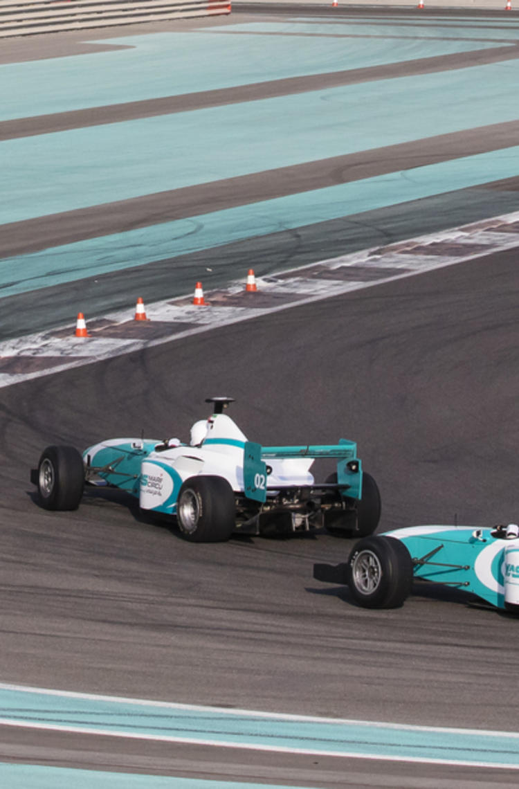 f1 race cars driving