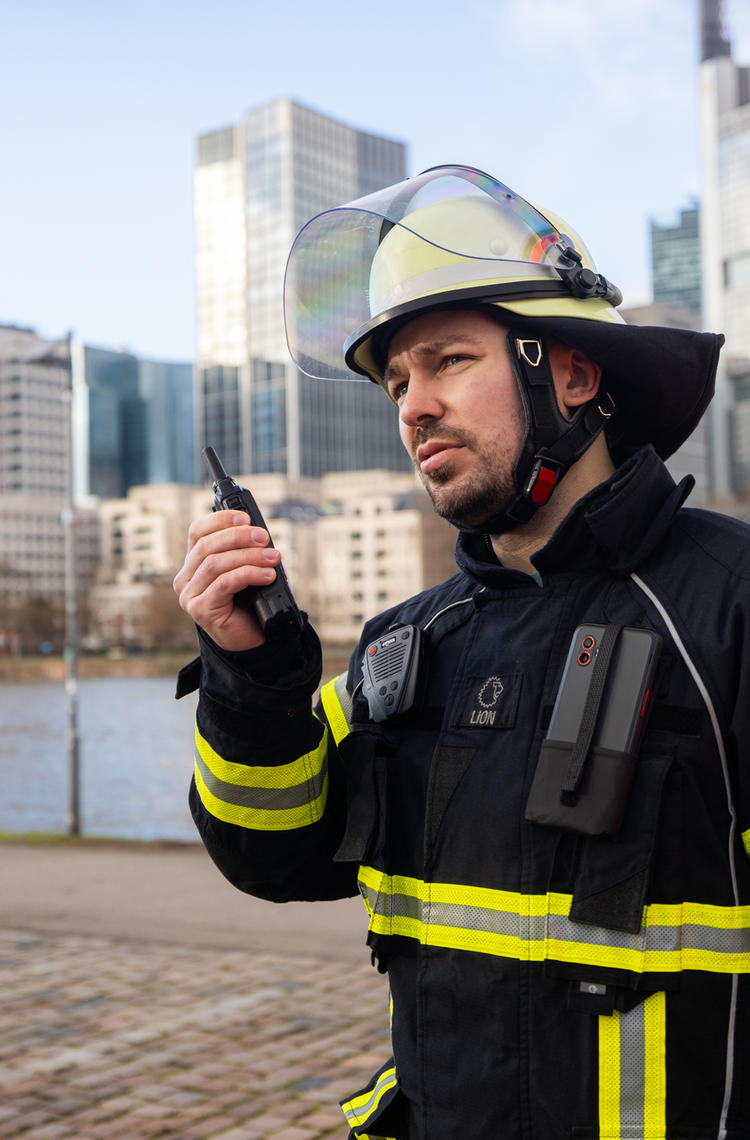 fireman_with_device_next_to_car_public_safety fireman_with_device_next_to_car_public_safety