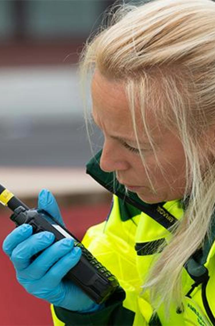 Paramedic talking to TH9 TETRA radio