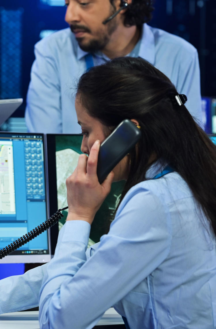 Command and control room officer talking to a TPH900 tetra terminal