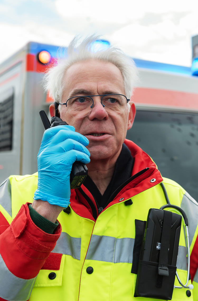 Paramedic talking to a TH9 TETRA terminal Paramedic talking to a TH9 TETRA terminal