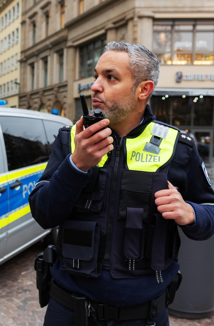 Police officer speaking to a TH9 TETRA terminal Police officer speaking to a TH9 TETRA terminal