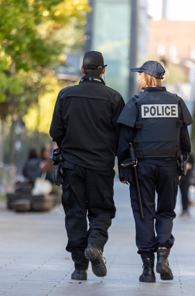 police_officers_walking_in_a_park.jpg