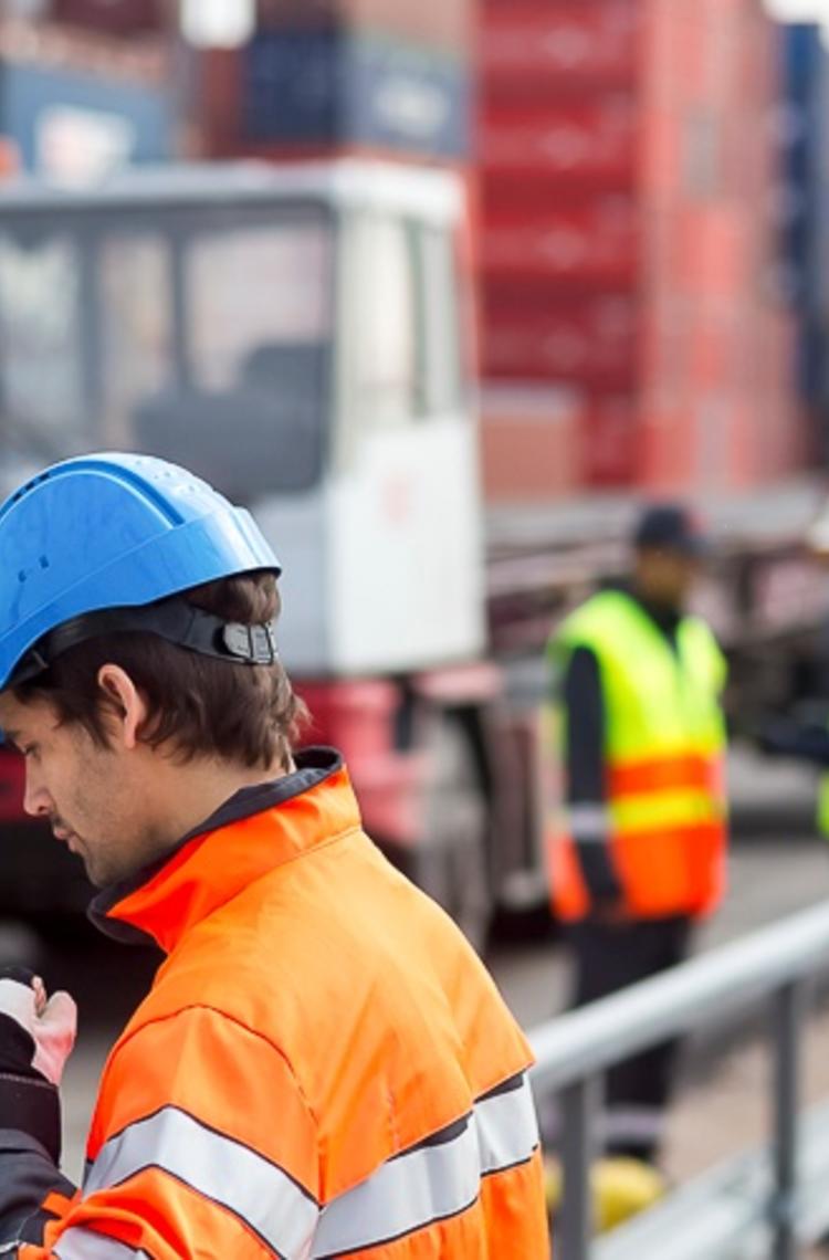 professional worker using TETRA radio in a port professional worker using TETRA radio in a port