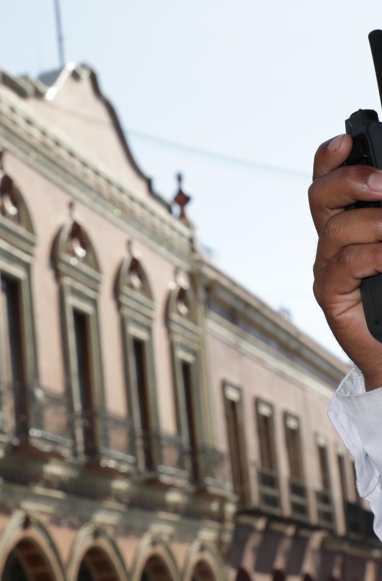 Police officer using a radio phone Police officer using a radio phone