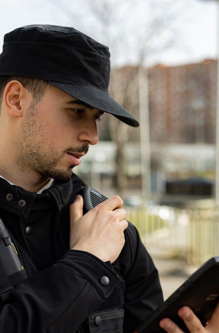 Security guard with tablet and push-to-talk Security guard with tablet and push-to-talk