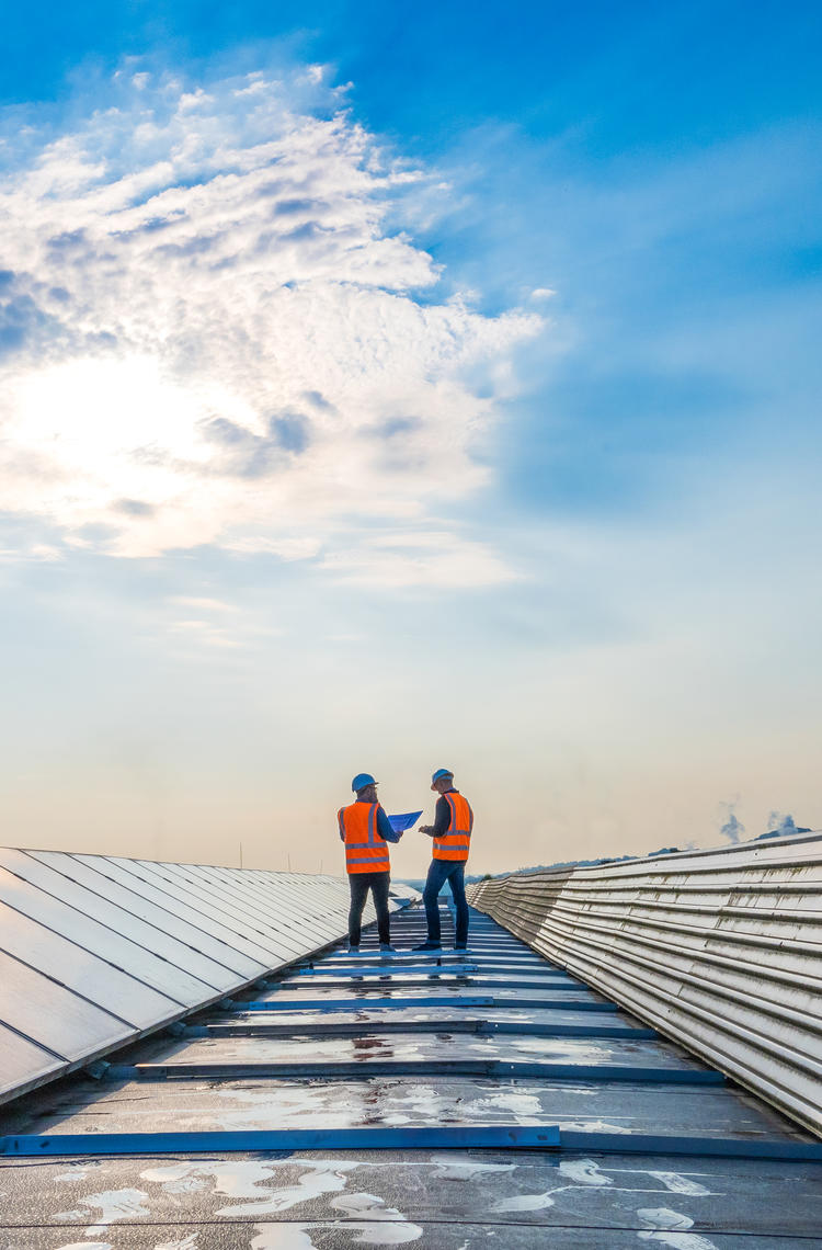 Industry workers on the roof