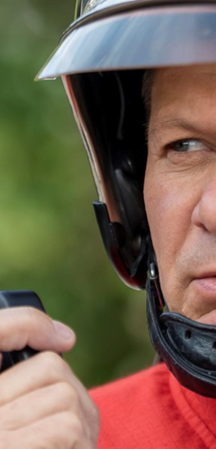 Fireman face focus using PTT accessory to communicate