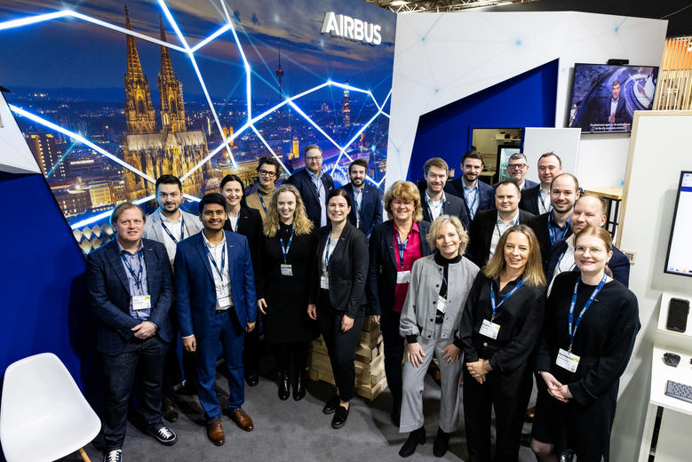 Airbus at PMRExpo 2023 - team group picture at the stand