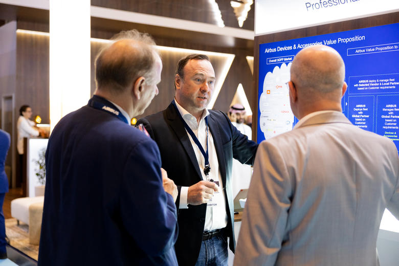 CCW 2024 in Dubai - Airbus Services manager presenting Services to two visitors