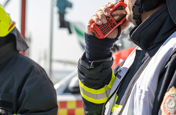 Fireman using thr9ex TETRA radio at Dubai airport