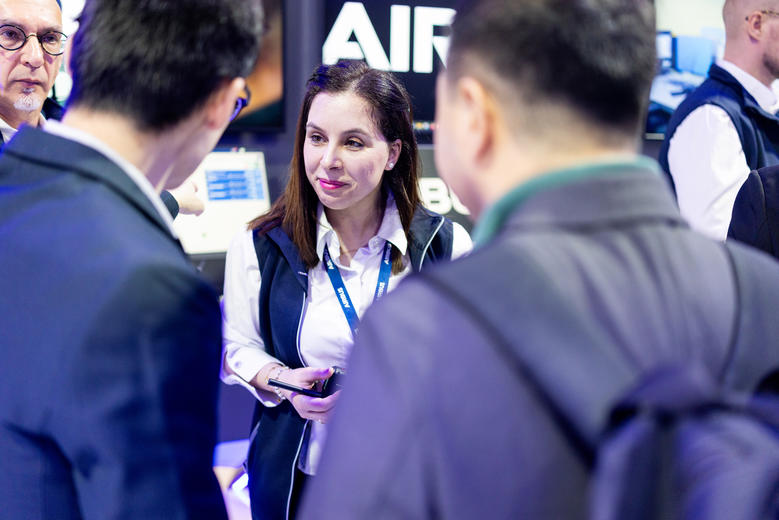 CCW 2025 Julie our business analyst discussing with visitors
